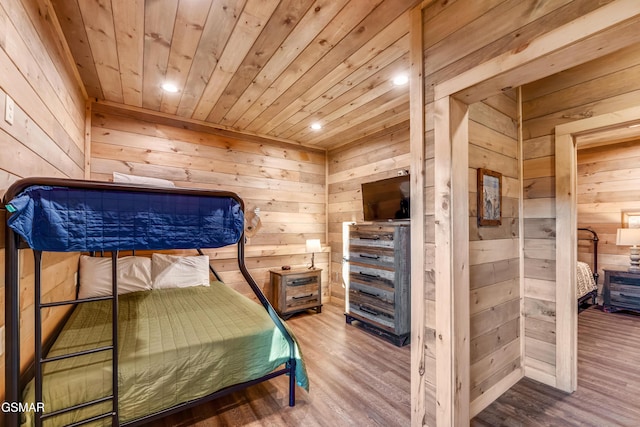 2862 Indigo Ln, Sevierville, TN 37862 - bedroom featuring wooden walls, wood ceiling, wood finished floors, and recessed lighting