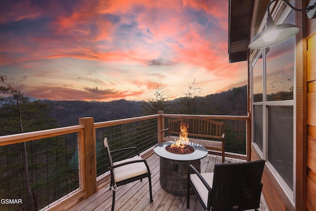 2862 Indigo Ln, Sevierville, TN 37862 - deck at dusk with an outdoor fire pit