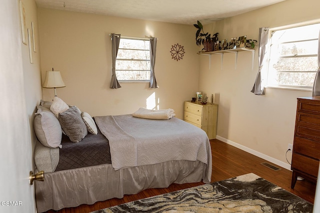 bedroom featuring dark hardwood / wood-style floors