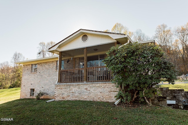 view of home's exterior with a lawn