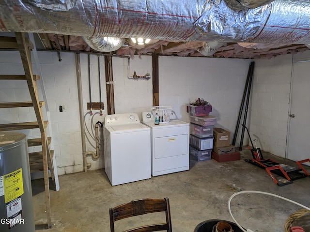 basement with washing machine and dryer and electric water heater