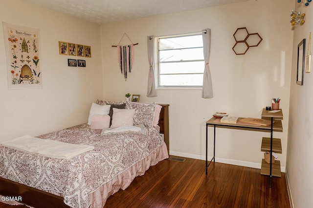 bedroom featuring dark wood-type flooring