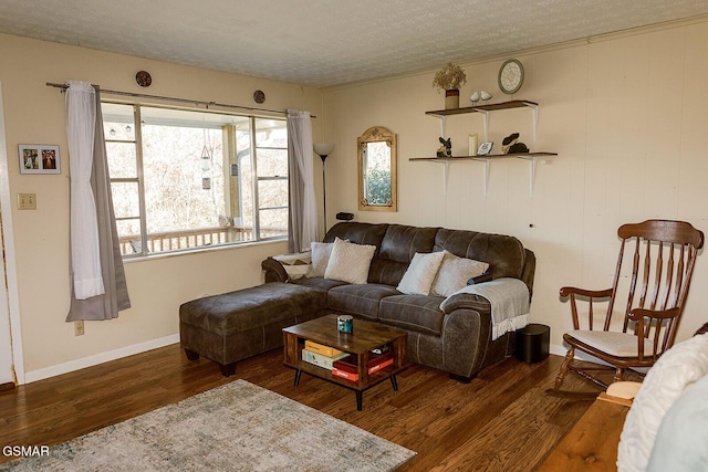 living room with dark hardwood / wood-style floors and a textured ceiling