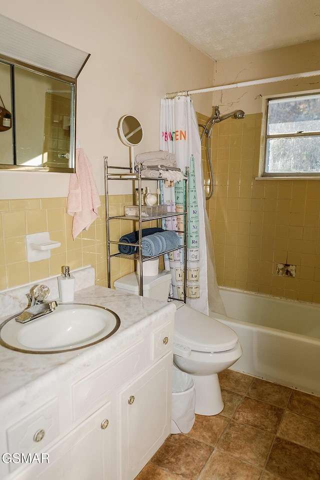 full bathroom featuring shower / tub combo, toilet, decorative backsplash, vanity, and tile walls