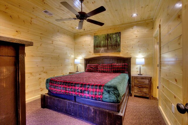 bedroom with carpet flooring, ceiling fan, wood ceiling, and wooden walls