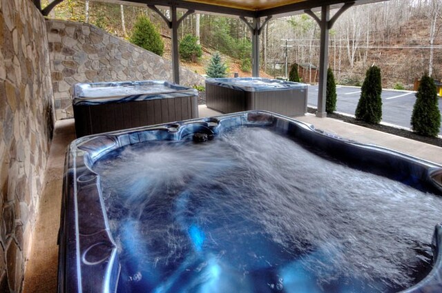 exterior space featuring a hot tub