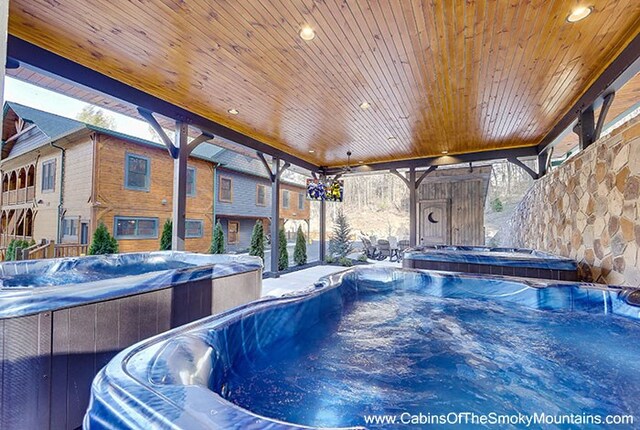 view of pool featuring a hot tub