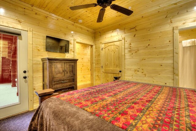 bedroom with carpet flooring, ceiling fan, wooden ceiling, and wood walls