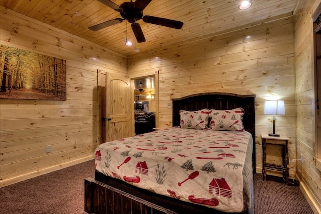 carpeted bedroom featuring wooden walls, ceiling fan, and wooden ceiling