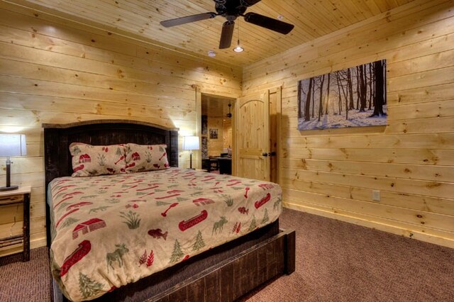 carpeted bedroom with ceiling fan, wood walls, and wood ceiling