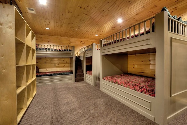 unfurnished bedroom with carpet floors and wood ceiling
