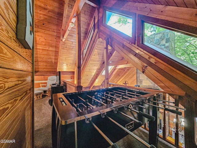 playroom featuring vaulted ceiling with beams, wooden walls, and wooden ceiling