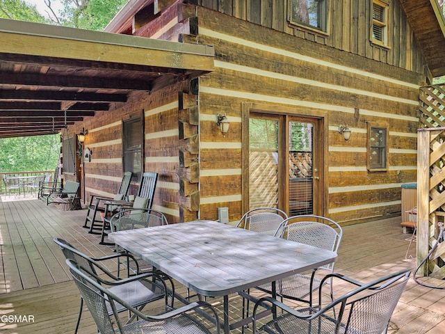 wooden deck featuring outdoor dining space
