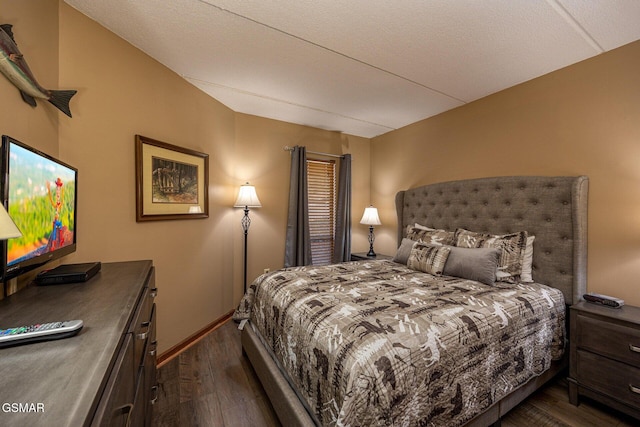 bedroom featuring dark hardwood / wood-style flooring