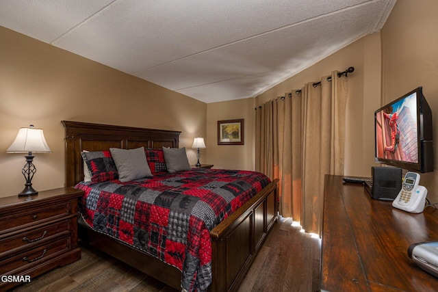 bedroom featuring dark hardwood / wood-style floors