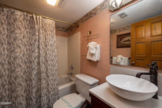 full bathroom with vanity, toilet, a textured ceiling, and shower / tub combo with curtain