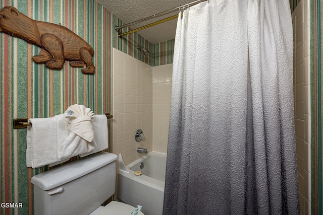 bathroom featuring toilet, shower / bathtub combination with curtain, and a textured ceiling