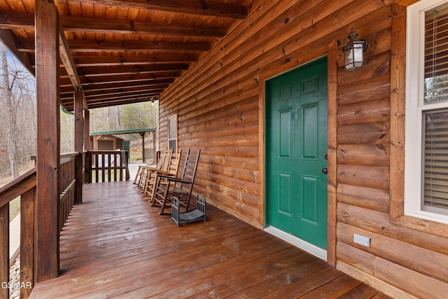 wooden terrace with a porch