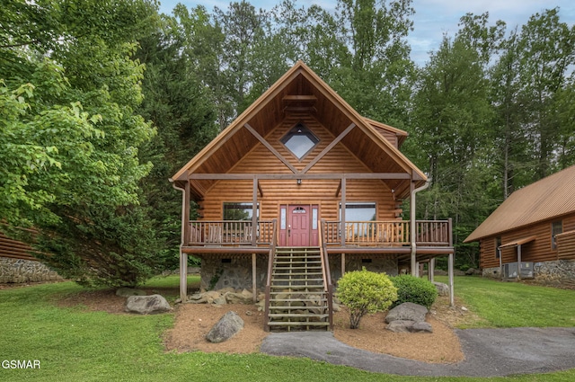 214 Forrest Loop Way, Gatlinburg, TN 37738 - log-style house featuring log siding, stairs, a front yard, and a wooden deck