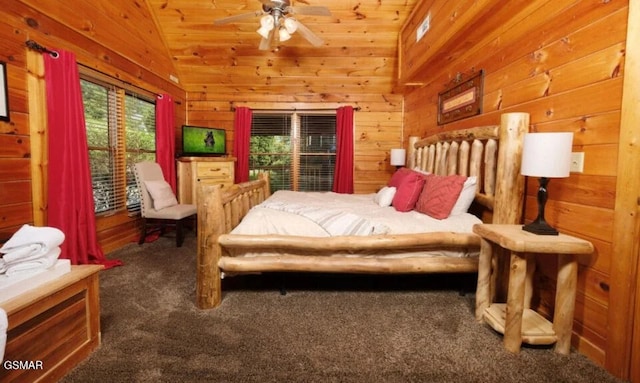 544 Royal Coachman Dr, Pigeon Forge, TN 37863 - carpeted bedroom with lofted ceiling and wooden walls