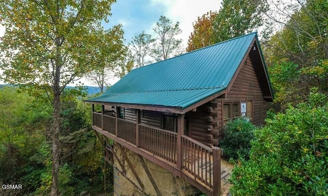 544 Royal Coachman Dr, Pigeon Forge, TN 37863 - rear view of house featuring log exterior and a metal roof