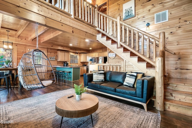 living room featuring dark hardwood / wood-style flooring, wood ceiling, beamed ceiling, and wood walls