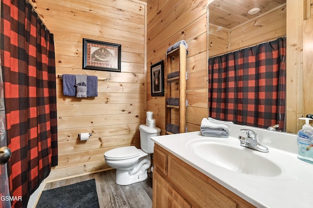 bathroom featuring vanity, hardwood / wood-style flooring, wooden walls, and wooden ceiling