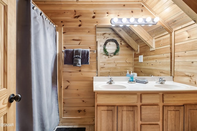 bathroom with vaulted ceiling with beams, vanity, a shower with curtain, wooden ceiling, and wood walls