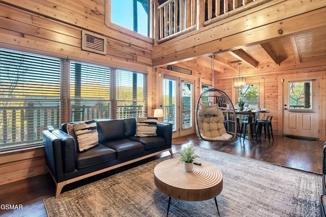 living room featuring wood walls, dark hardwood / wood-style flooring, and wooden ceiling