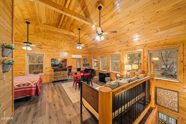 living room with wood ceiling, a wall mounted AC, wood-type flooring, beamed ceiling, and wood walls