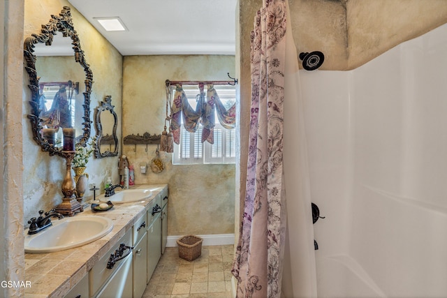 bathroom with vanity and walk in shower