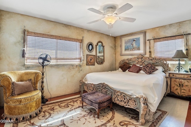 bedroom featuring ceiling fan and light hardwood / wood-style floors