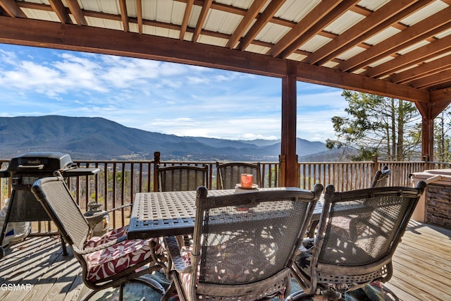 wooden deck with a mountain view