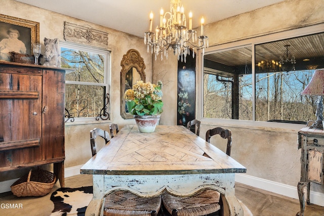 dining room featuring a notable chandelier