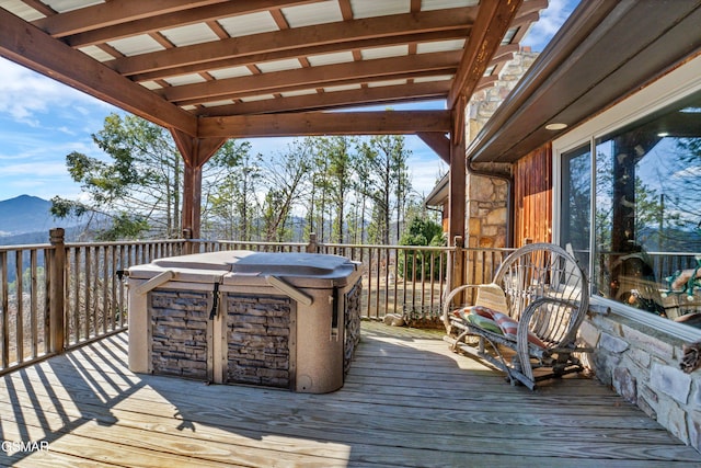 deck featuring a hot tub