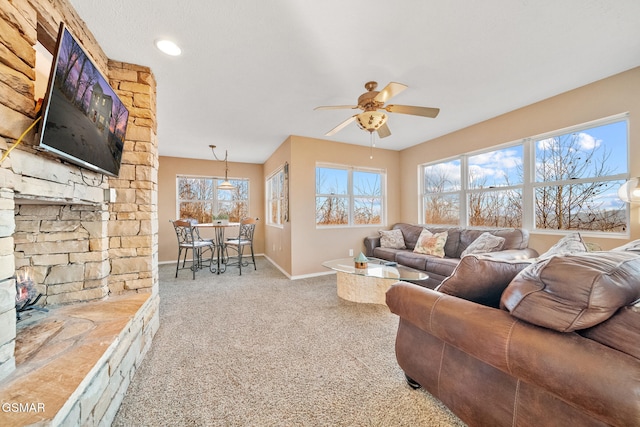 living room featuring ceiling fan and light carpet