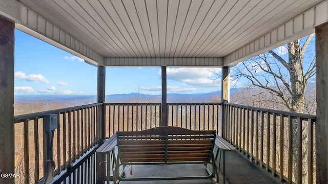 wooden deck featuring a mountain view