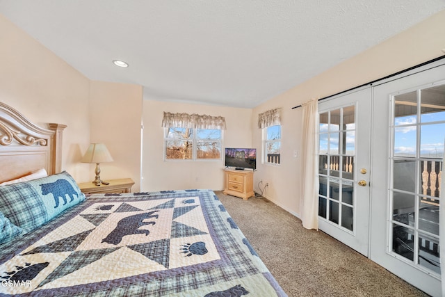 carpeted bedroom with french doors and access to outside