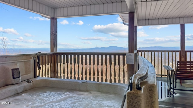 wooden terrace featuring a mountain view