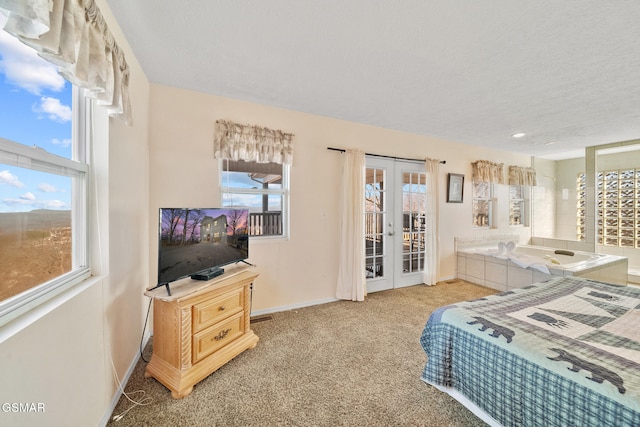 carpeted bedroom with multiple windows, access to outside, a textured ceiling, and french doors