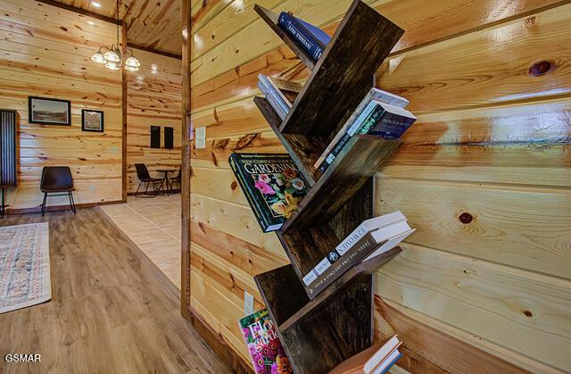 interior space featuring hardwood / wood-style floors and wood walls