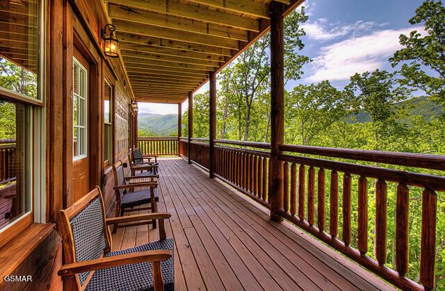 wooden terrace with a porch