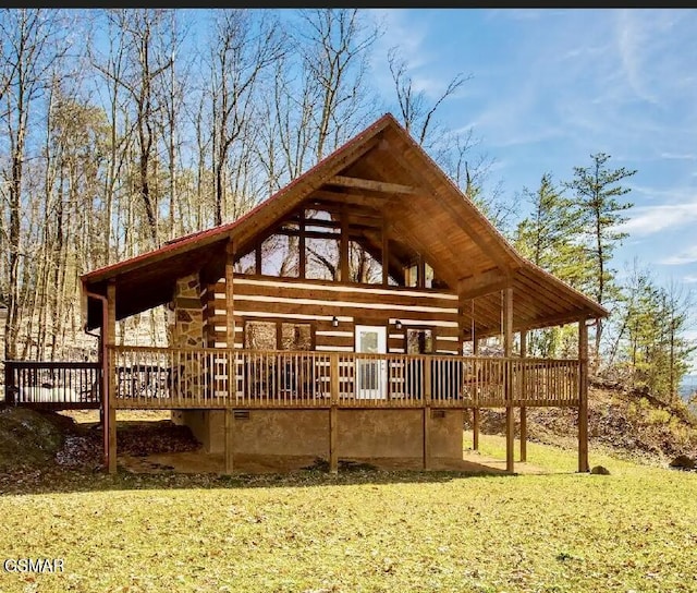 view of property's community with a deck and a lawn