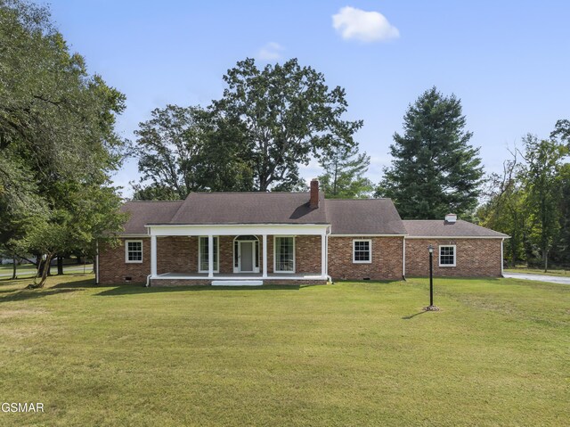 ranch-style home featuring a front yard and a porch