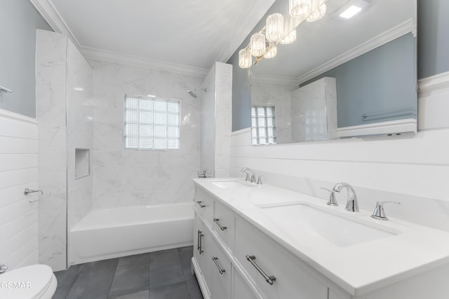 full bathroom featuring toilet, crown molding, plenty of natural light, and tiled shower / bath