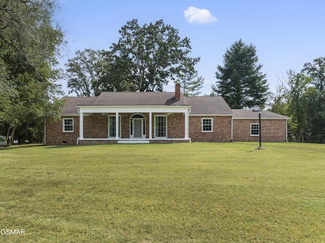 ranch-style home with a porch and a front lawn