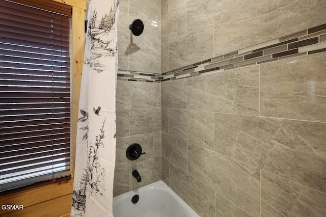 bathroom featuring shower / bath combination with curtain