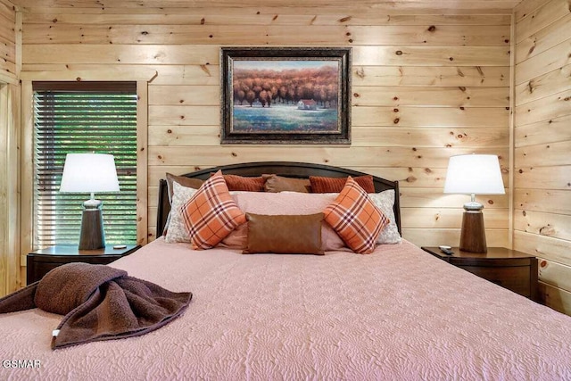 bedroom featuring wooden walls