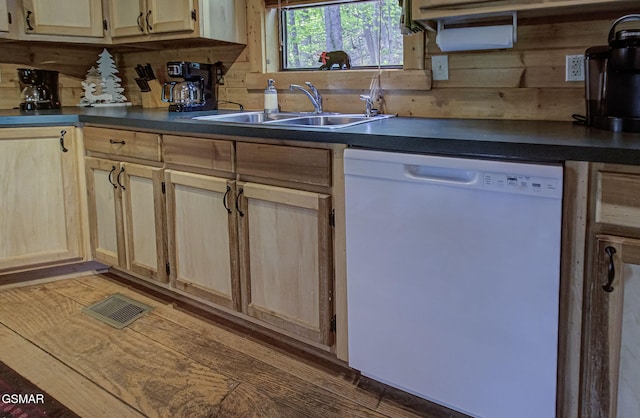 3050 Headrick Dr, Sevierville, TN 37862 - kitchen with dark countertops, a sink, light brown cabinets, dishwasher, and visible vents