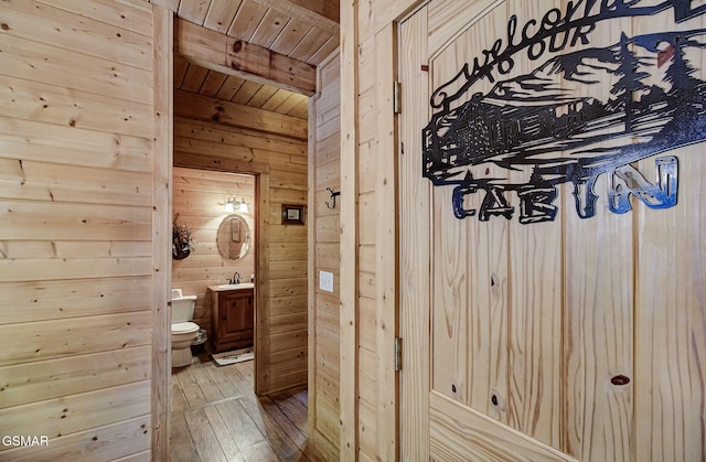 3050 Headrick Dr, Sevierville, TN 37862 - bathroom featuring toilet, wood walls, wooden ceiling, and vanity